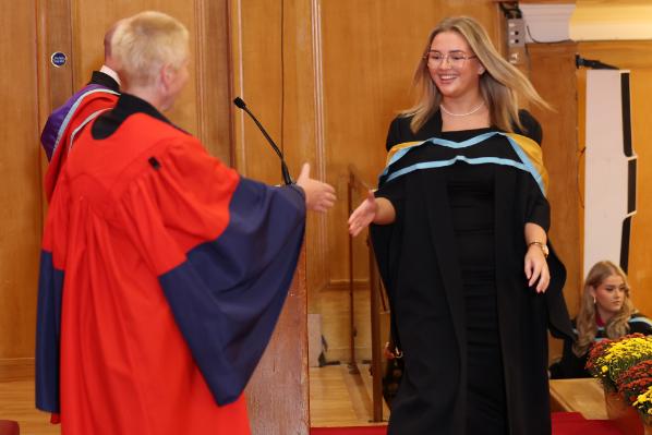 Graduates receiving their award